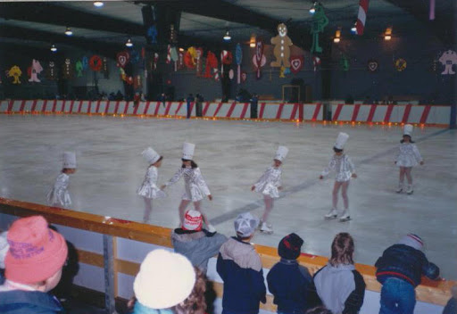 In the satin heavily spangled dress.